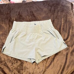 Sage green work out shorts.